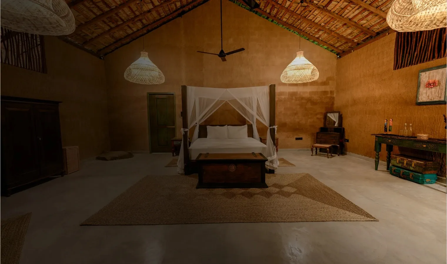 A Yakaduru Yala room with a canopy bed under a thatched roof